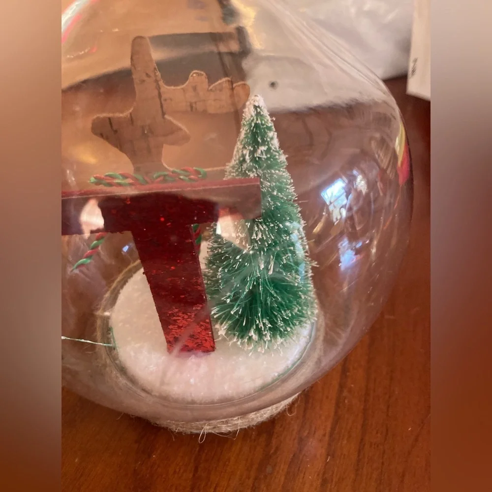 Holiday plastic globe Ornament with Red Letter T and Green Tree. Brand new